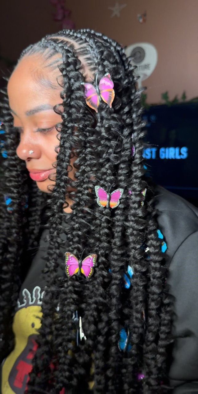 12 Braids Hairstyles: 16 Ideas From Box Braids to Cornrows 6 Woman with long black curly braids decorated with colorful butterfly hair clips.
