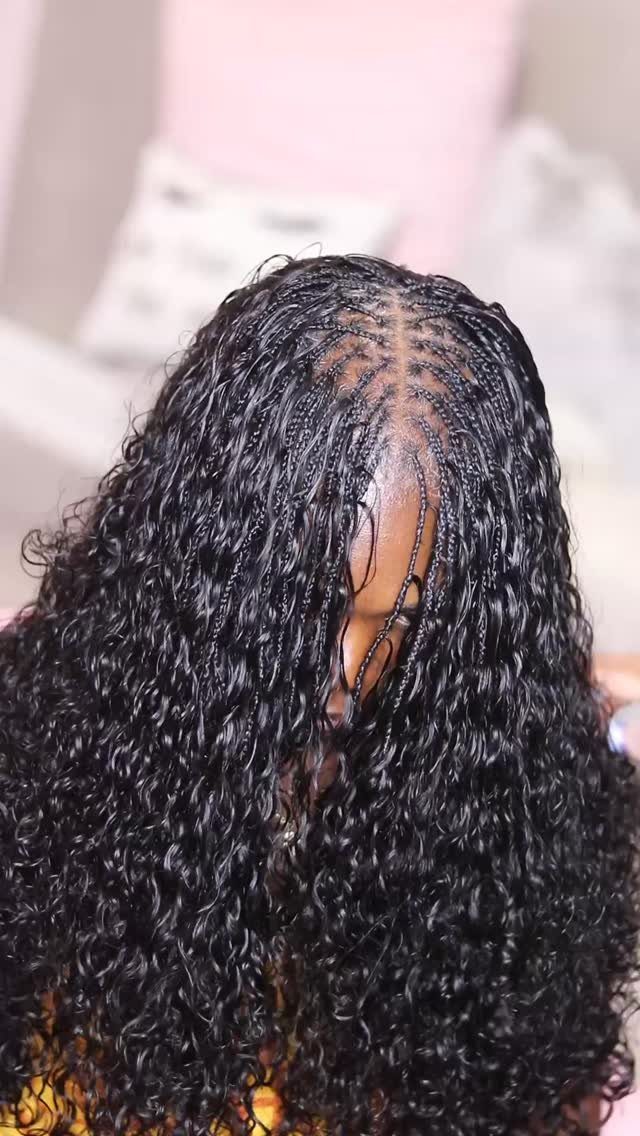 12 Braids Hairstyles: 16 Ideas From Box Braids to Cornrows 3 Person with black micro braids transitioning into long, voluminous curly hair.
