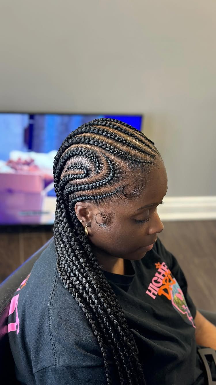 12 Braids Hairstyles: 16 Ideas From Box Braids to Cornrows 8 Woman with curved stitch braids flowing from her forehead to a long ponytail.