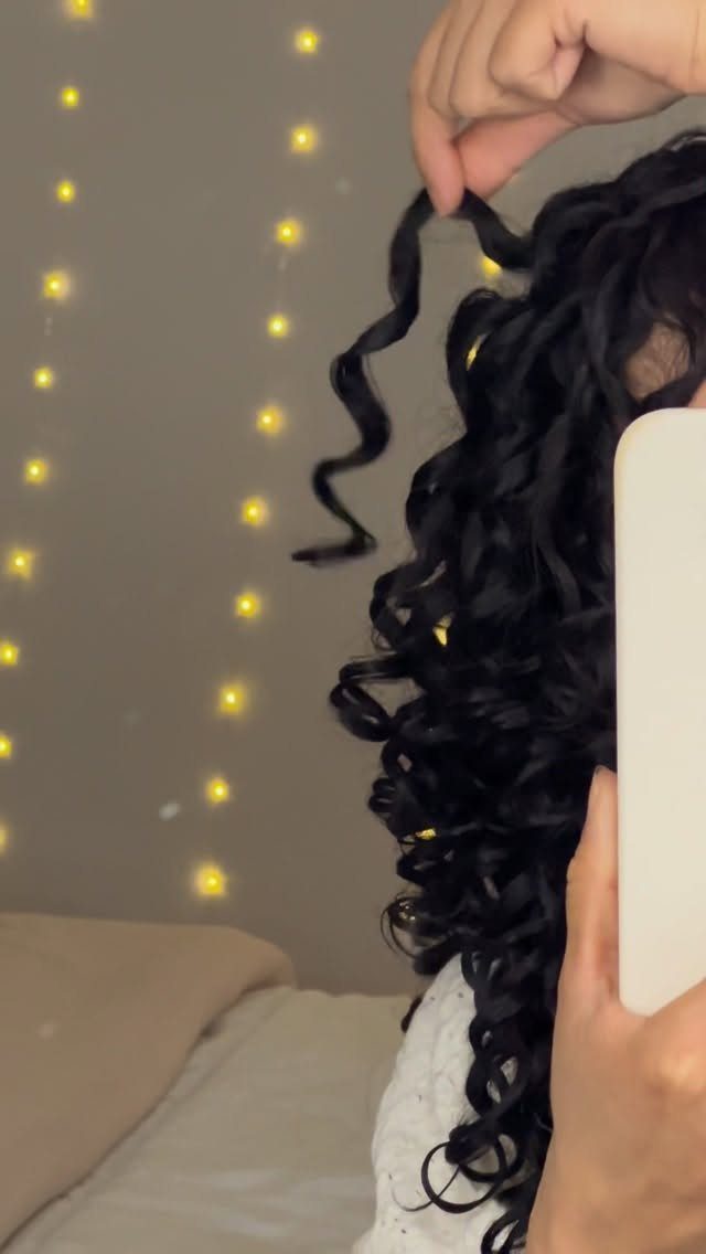 3A Hair Long: 4 Ideas for Pineapples, Ringlets and More 2 Long dark curly hair with defined ringlets held up in a mirror selfie.