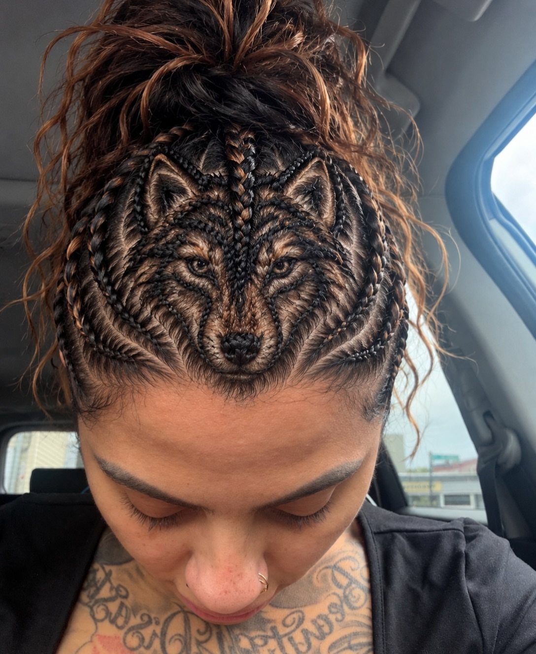 16 Big Cornrow Hairstyles for Bold, Standout Looks 16 Woman with cornrow braids intricately styled into a wolf face on her scalp.