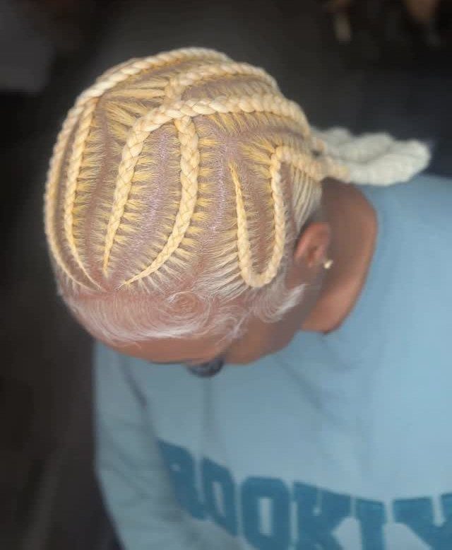 16 Big Cornrow Hairstyles for Bold, Standout Looks 5 Blonde cornrow braids styled in a crisscrossed pattern on a person's head.