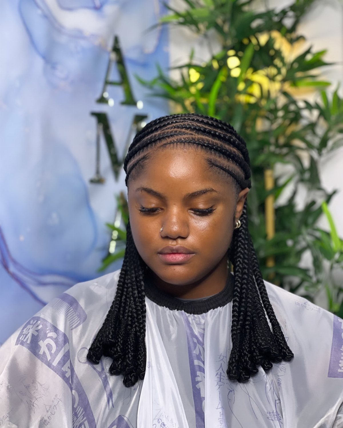 16 Big Cornrow Hairstyles for Bold, Standout Looks 11 Woman with straight back cornrows ending in two thick braided ponytails.