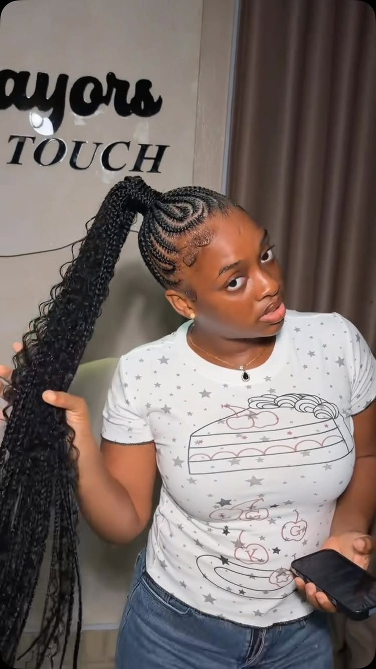 31 Black Hair Natural Hairstyles for Every Length 29 Woman with black hair in cornrows and a long curly high ponytail.