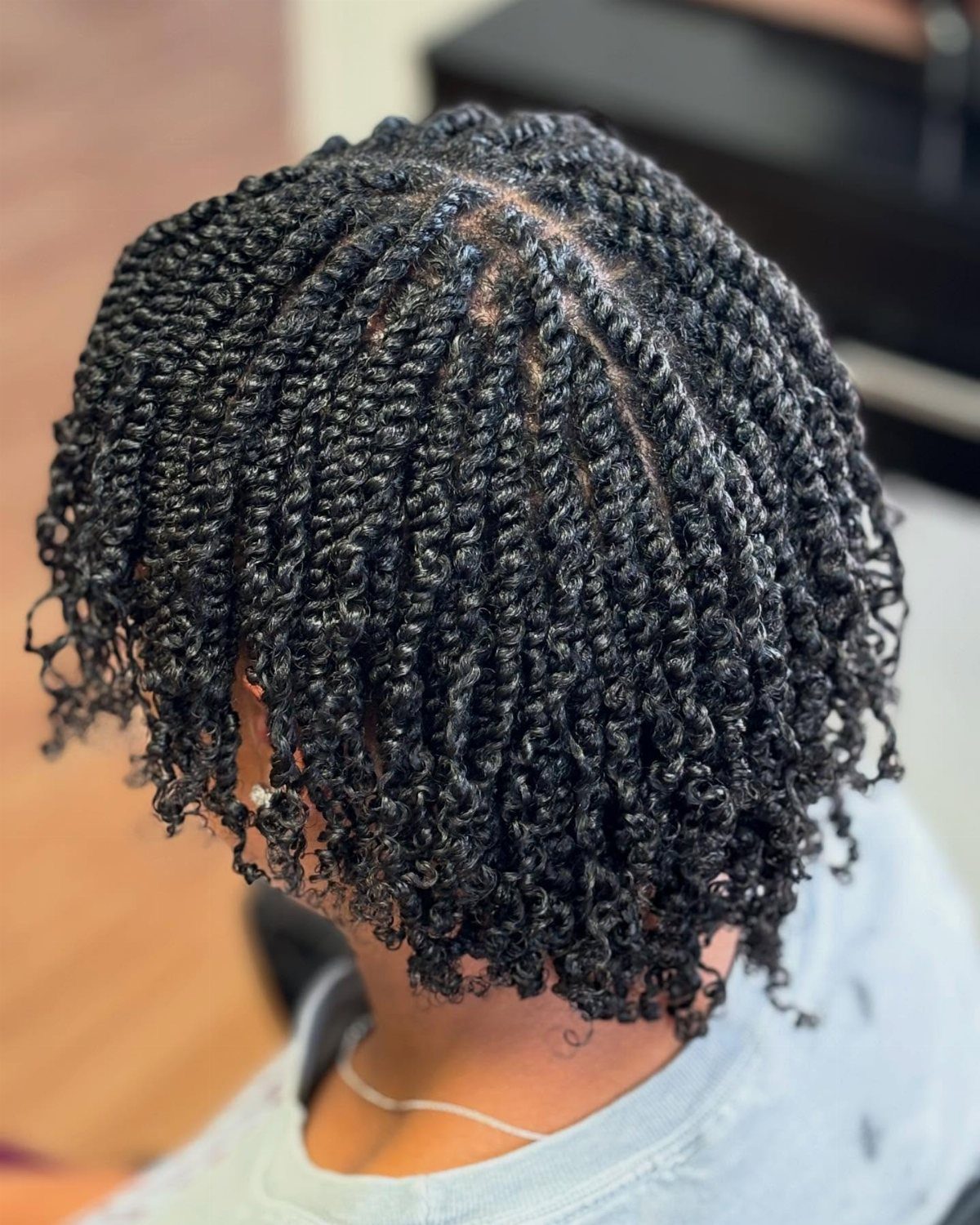 31 Black Hair Natural Hairstyles for Every Length 7 Short black natural hair styled in small, defined twists and curls.