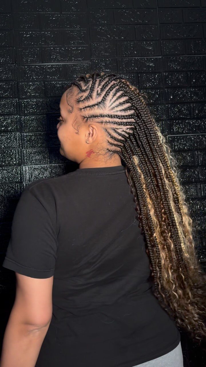 15 Braid Hairstyles for Thick Hair, From Bubble to Boho 10 Woman with cornrows curving into a long braided faux hawk with blonde tips.