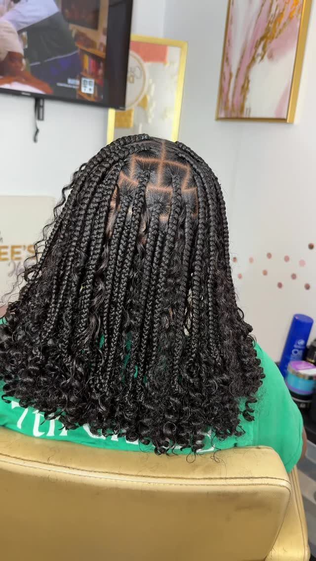 16 Braids Going Back with Curls: Styles to Try 3 Bob-length black box braids with curly ends seen from the back.