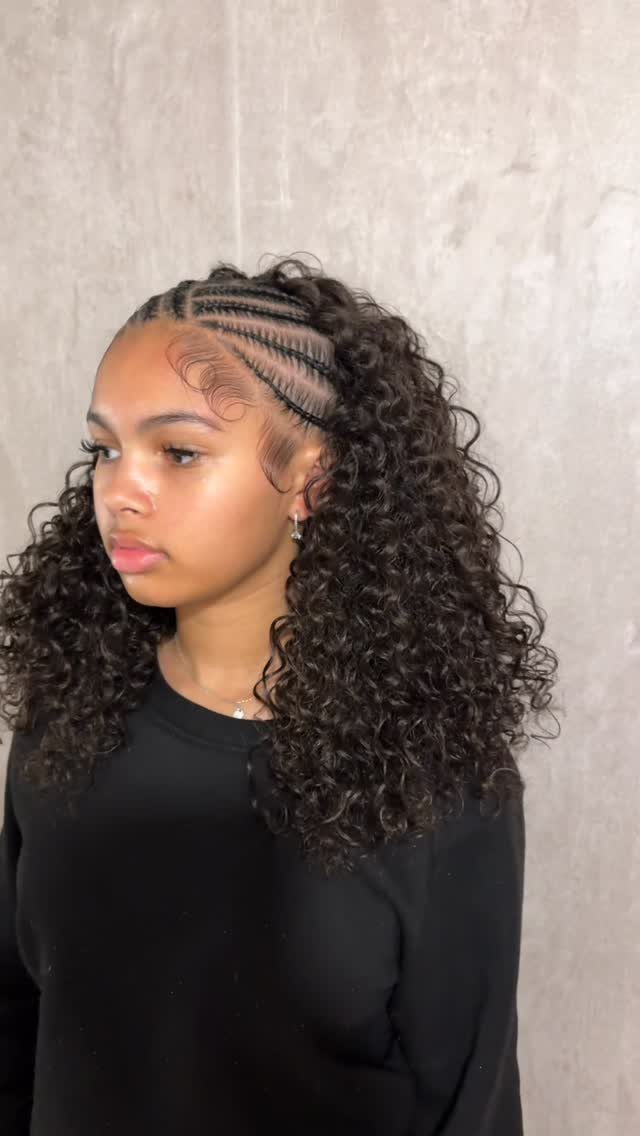 16 Braids Going Back with Curls: Styles to Try 13 Woman with cornrow braids leading back into long, voluminous dark curly hair.