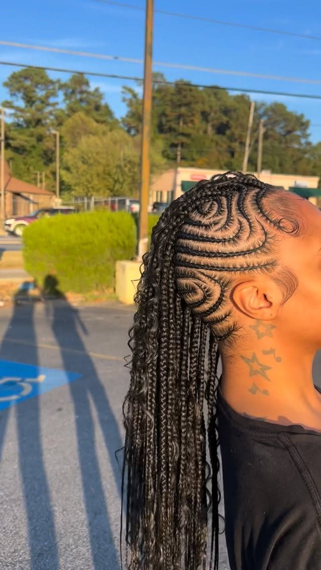 16 Braids Going Back with Curls: Styles to Try 6 Person with curved cornrow braids transitioning into long curly braids in a parking lot