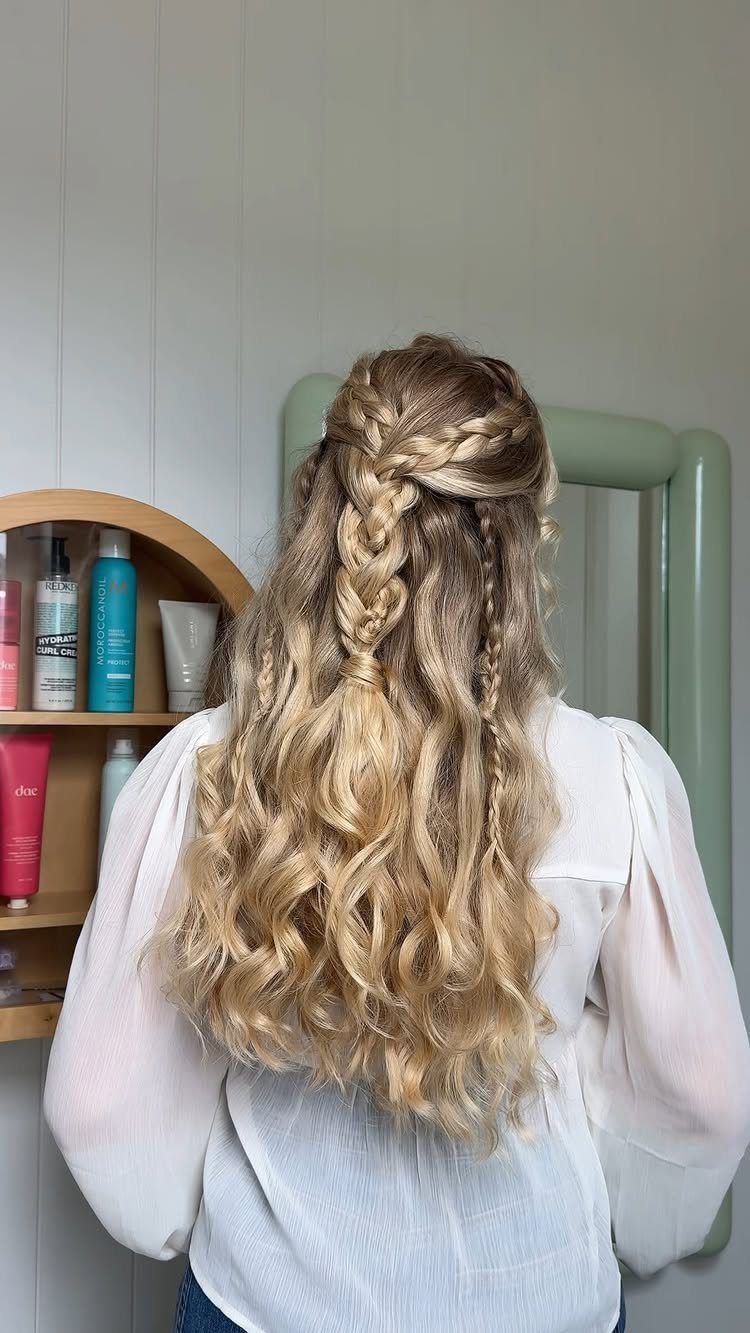 16 Braids Going Back with Curls: Styles to Try 1 Blonde hair styled in a half-up braid with long loose curls below.