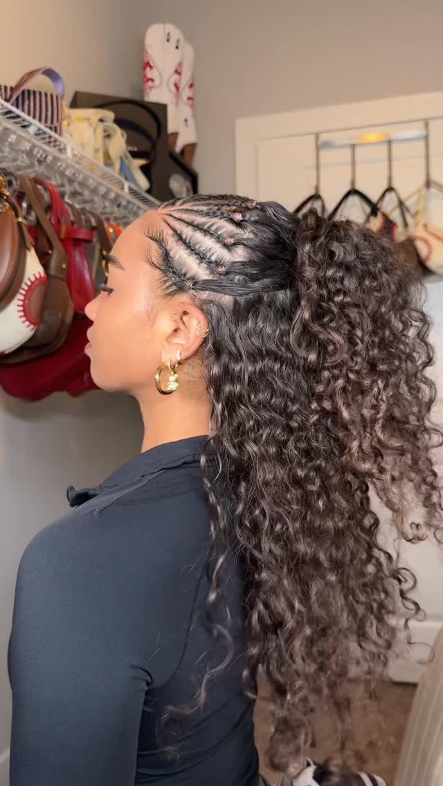 16 Braids Going Back with Curls: Styles to Try 11 Woman with cornrow braids leading back into a high ponytail of long curls.