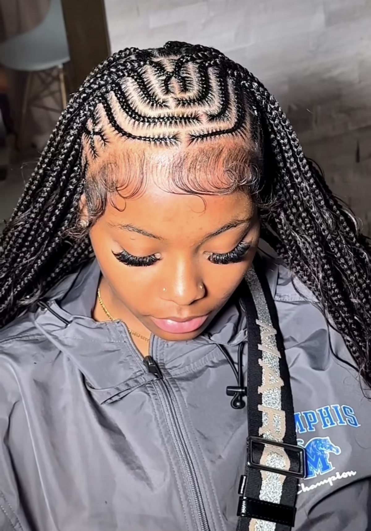 Braids in the Front Tracks in the Back: 5 Ideas 1 Woman with long black box braids and a curved honeycomb pattern on top.