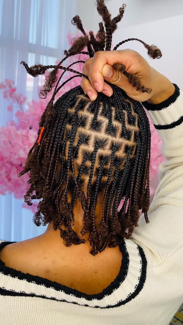 9 Braids with Natural Hair Only: Styles Without Extensions 8 Intricate geometric braids on dark brown natural hair ending in curly twists.
