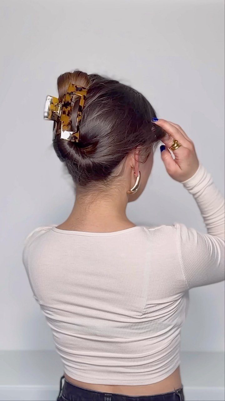 10 Clip Up Hairstyles with Claw Clips and Accent Clips 4 Woman with brown hair in a messy French twist secured by a claw clip