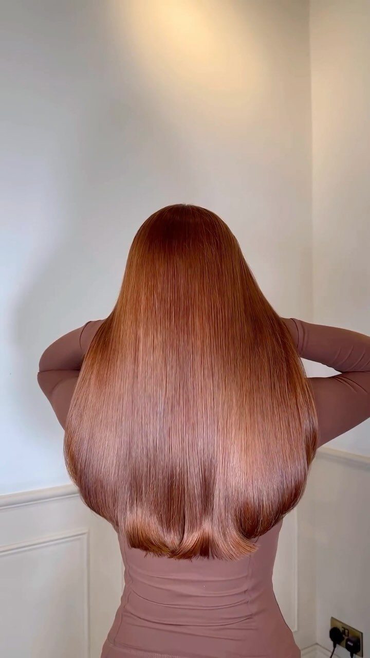 Cowboy Hair Color Ideas: 6 Copper Shades to Try 6 Long straight copper-brown hair shown from the back against a white wall