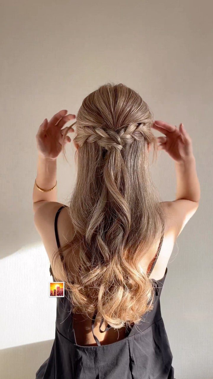 9 Cute Hair Styles for Church, From Buns to Box Braids 6 Woman with long blonde wavy hair featuring a horizontal braid across the back.
