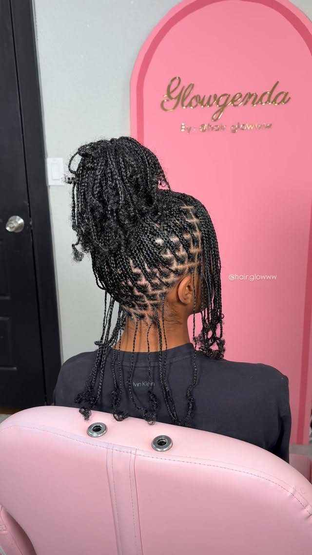 9 Cute Hair Styles for Church, From Buns to Box Braids 4 Braided high ponytail on a person sitting in a pink salon chair.