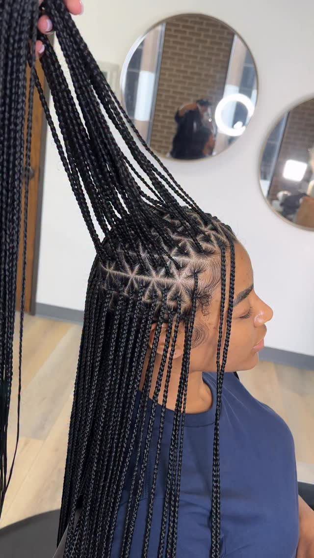 9 Cute Hair Styles for Church, From Buns to Box Braids 8 Woman with long black box braids and a geometric scalp braiding pattern.