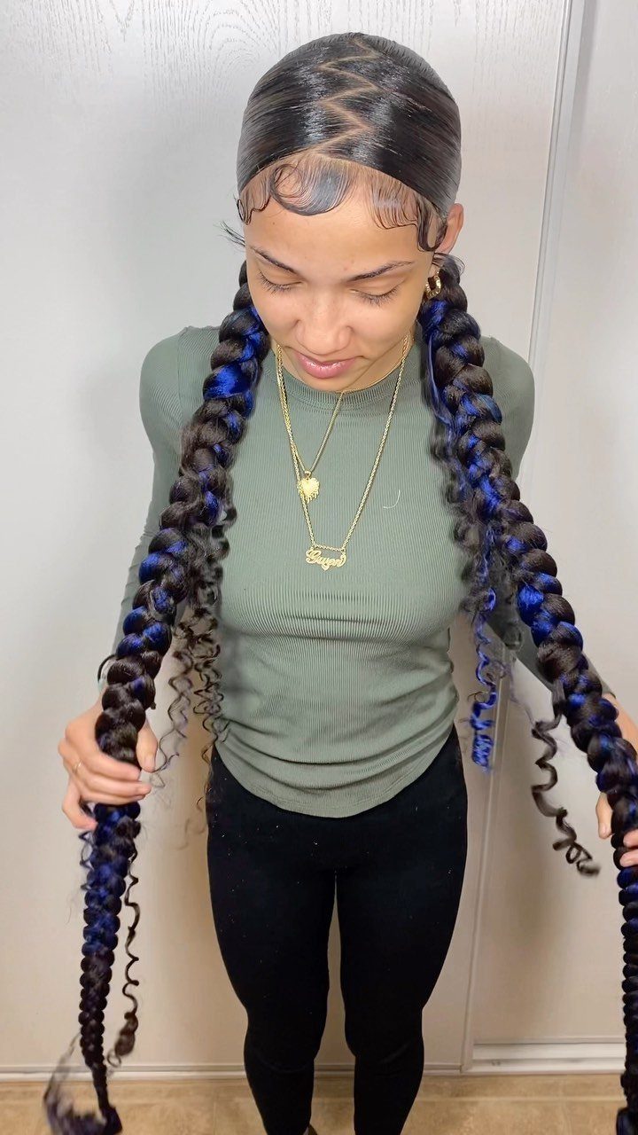 16 Cute Hairstyles for a Birthday Party, Waves to Braids 16 Woman with long black and blue braided pigtails wearing a green shirt.