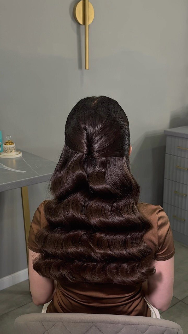 16 Cute Hairstyles for a Birthday Party, Waves to Braids 1 Long dark brown hair styled in polished, voluminous Hollywood waves from behind.