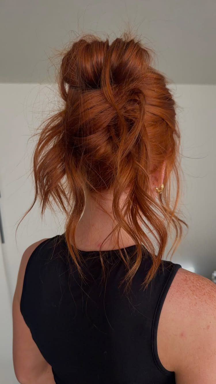 Cute Hairstyles for Hot Days: 11 Easy Ideas to Try 1 Reddish-brown hair styled in a loose, effortless messy bun from the back.