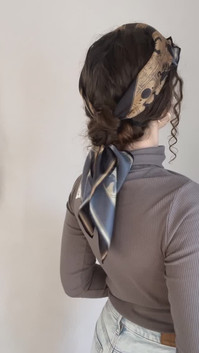 Cute Hairstyles for Hot Days: 11 Easy Ideas to Try 2 Woman with dark hair in a low bun wrapped in a patterned silk scarf.