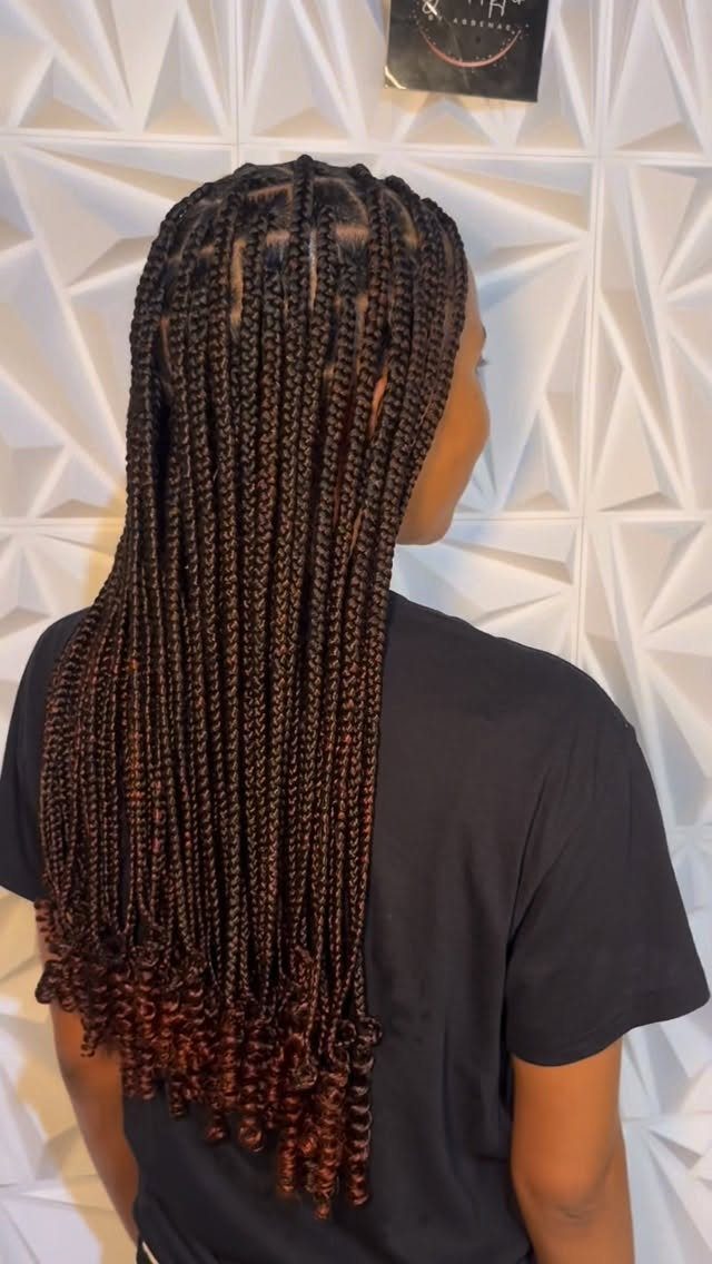 17 Cute Hairstyles for Picture Day, From Braids to Buns 16 Long brown box braids with tight curls at the ends on a person