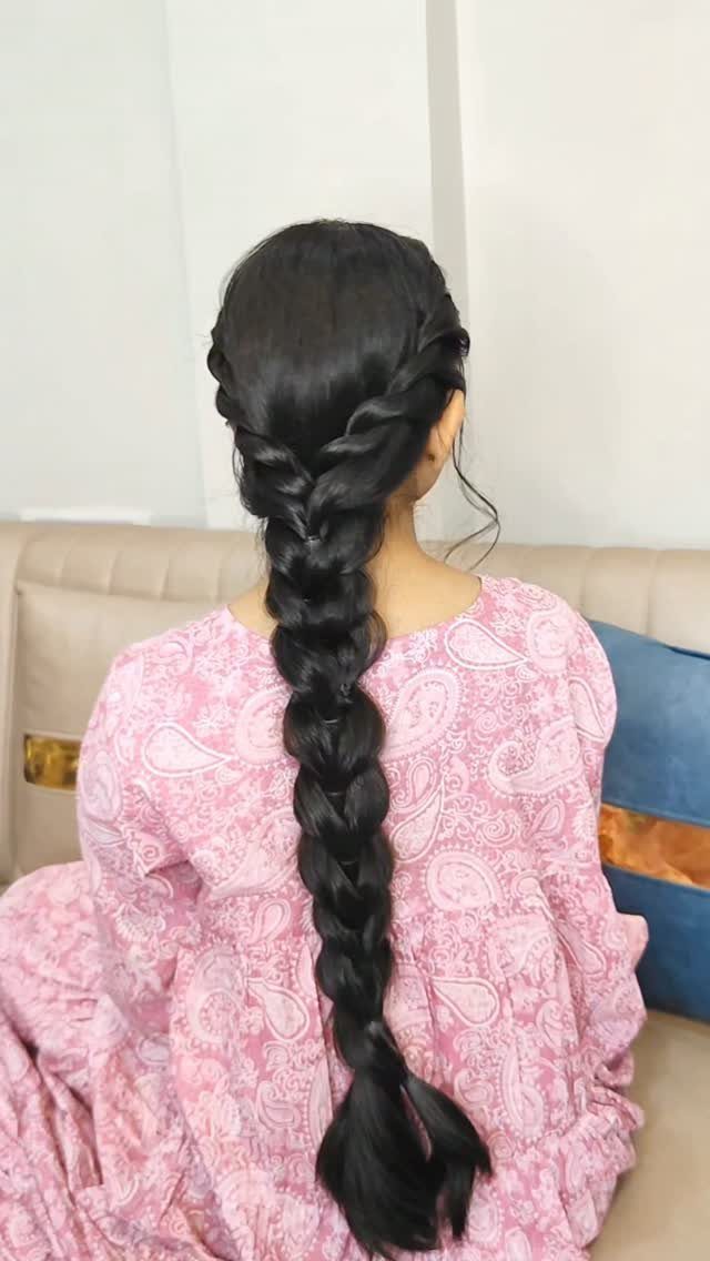 17 Cute Hairstyles for Picture Day, From Braids to Buns 3 Long black hair styled in a thick twist braid on a person's back