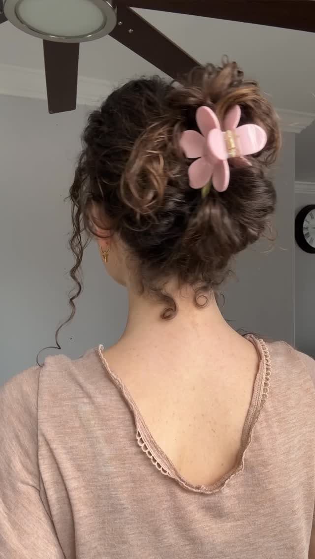16 Easy Hair Styles for Beginners to Try at Home 12 Curly brown hair in a loose updo secured with a pink flower clip