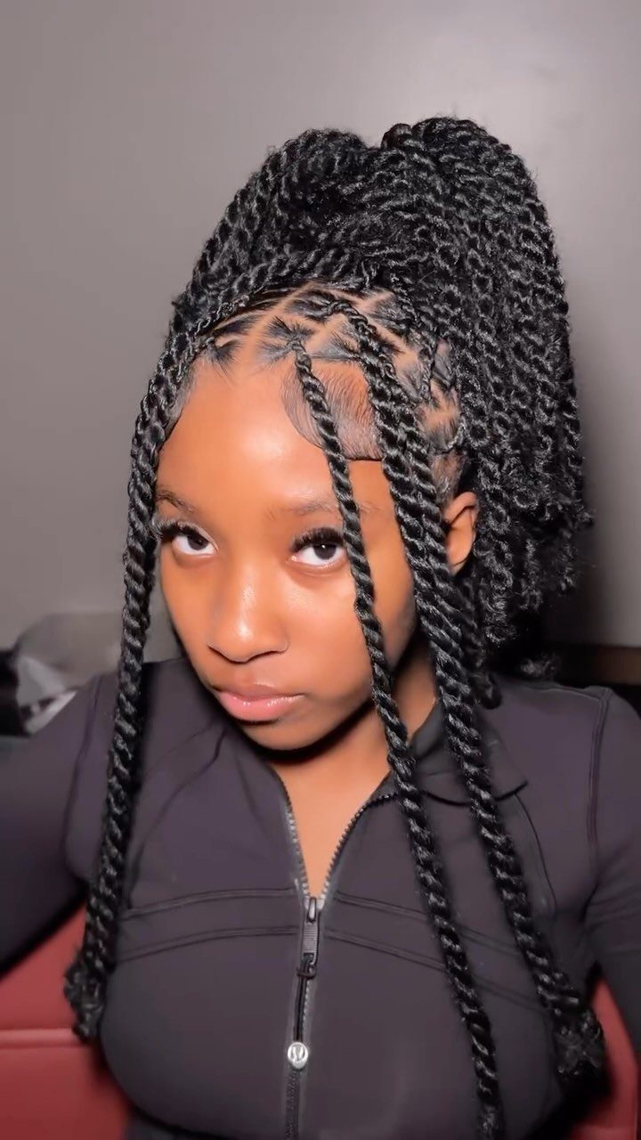 16 Easy Hair Styles for Beginners to Try at Home 15 Woman with black two-strand twists styled in a high ponytail with loose face-framing strands.
