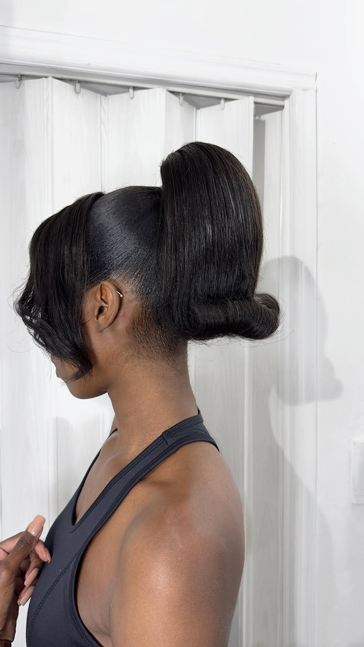 18 Easy Hairstyles for Medium Hair You Can Do Fast 7 Woman with a high, voluminous ponytail that flips outward at the ends.
