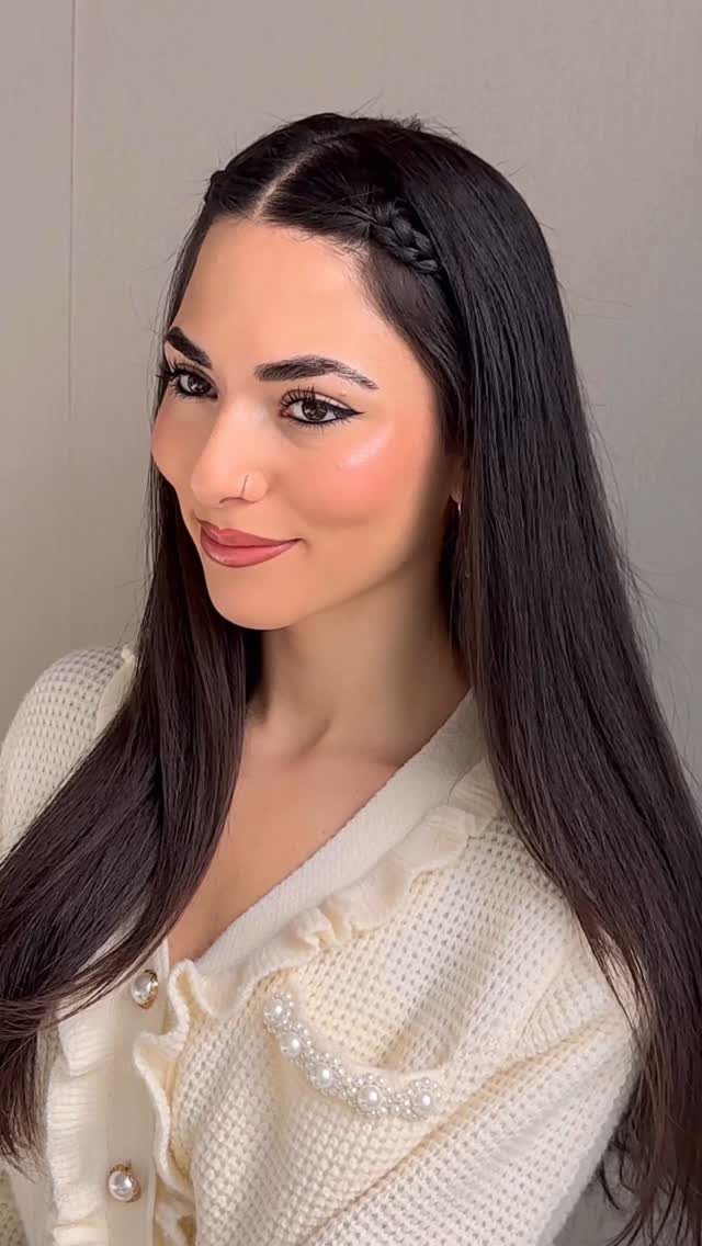 18 Easy Hairstyles for Medium Hair You Can Do Fast 4 Woman with long dark hair featuring a small front braid along the hairline.