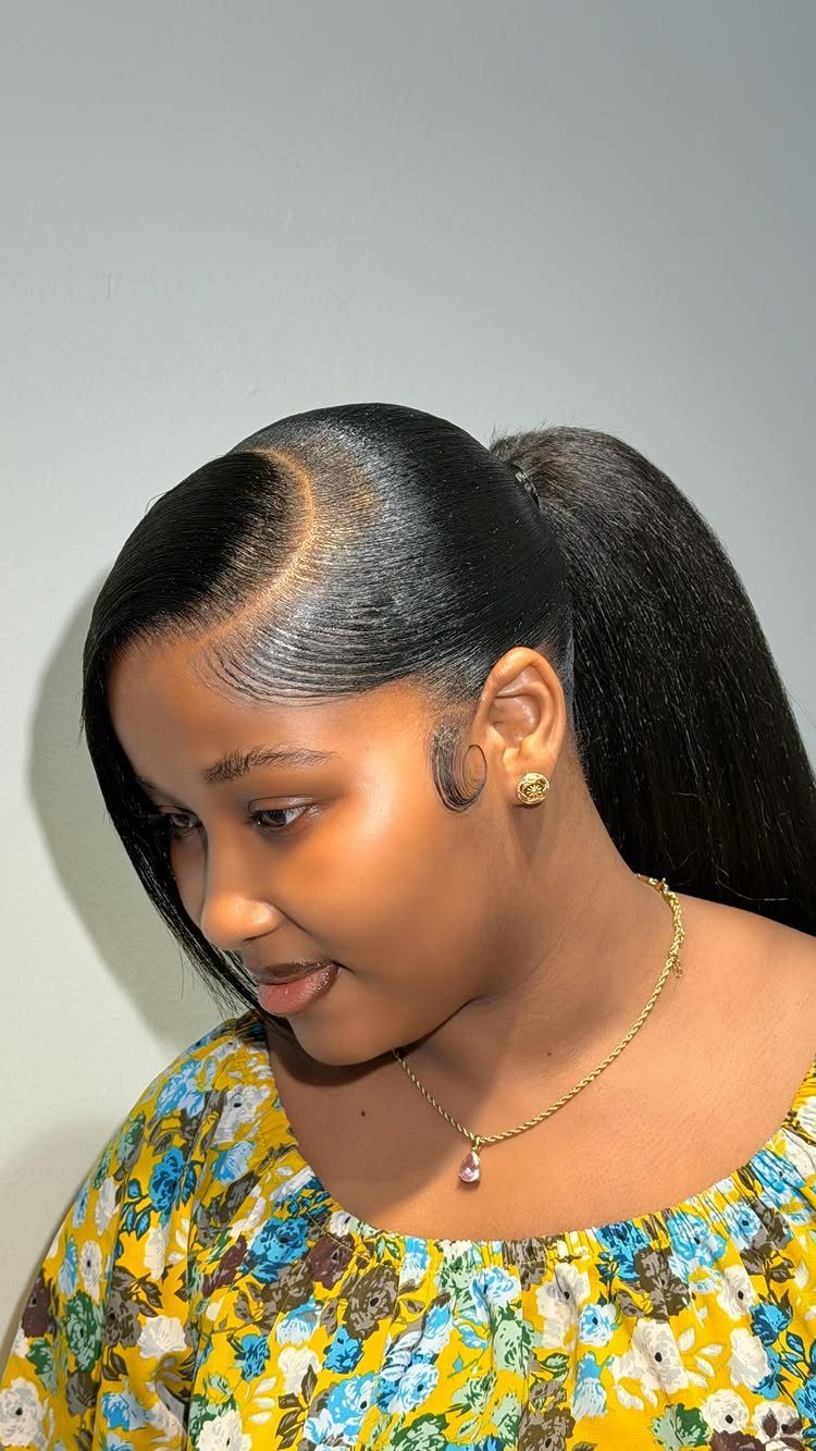 18 Easy Hairstyles for Medium Hair You Can Do Fast 16 Woman with sleek high ponytail and side part wearing yellow floral top