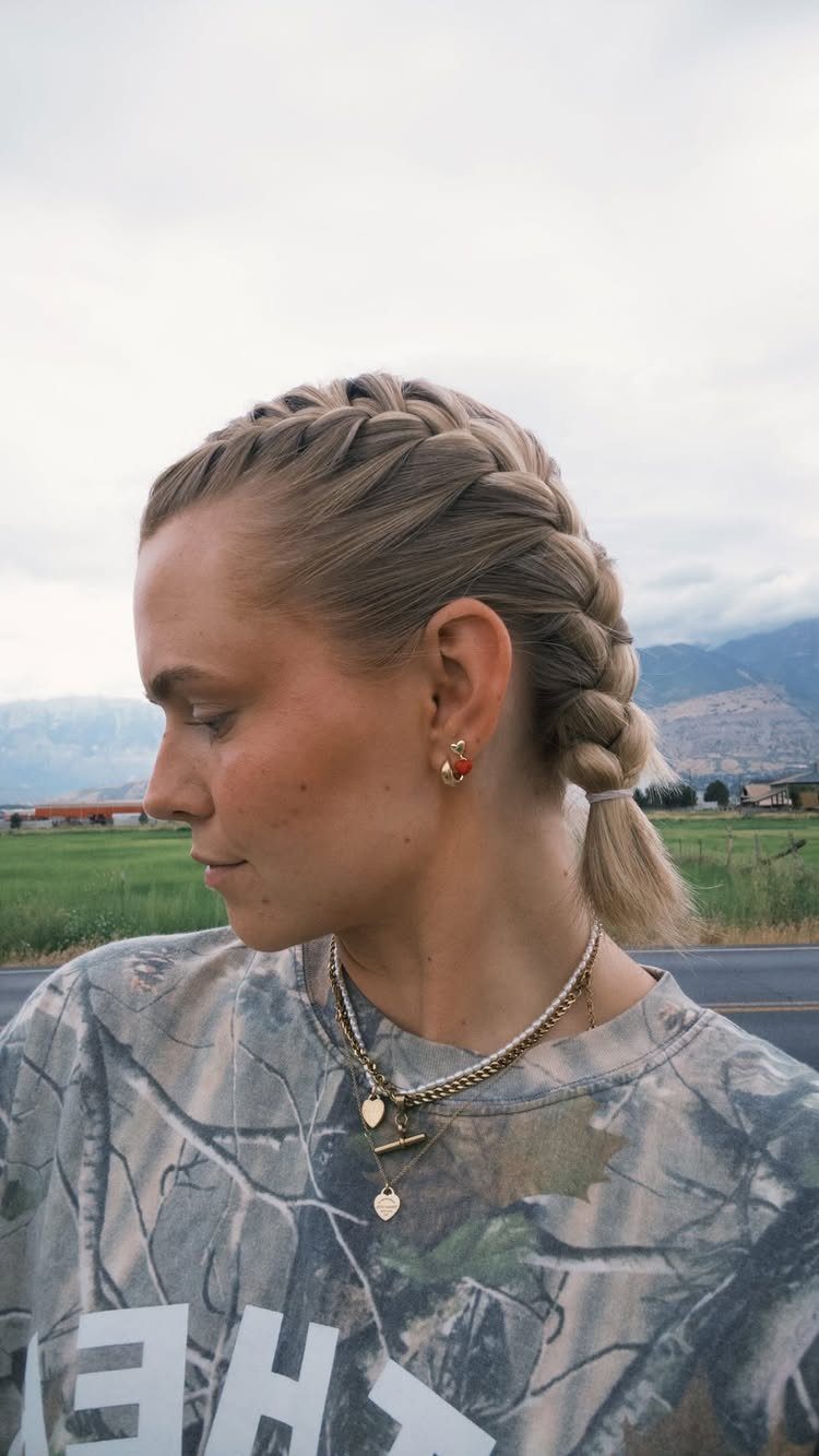 Easy One Braid Styles: 5 Ideas for Every Hair Type 3 Woman with blonde hair styled in a thick Dutch braid in outdoor setting