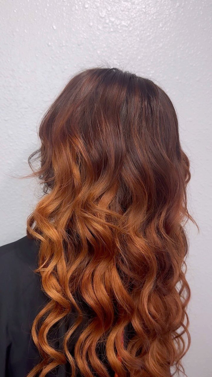 Fall Hair Dos with 15 Ideas from Burnt Copper to Claw Clips 13 Long wavy hair with a dark brown to burnt copper ombre transition.