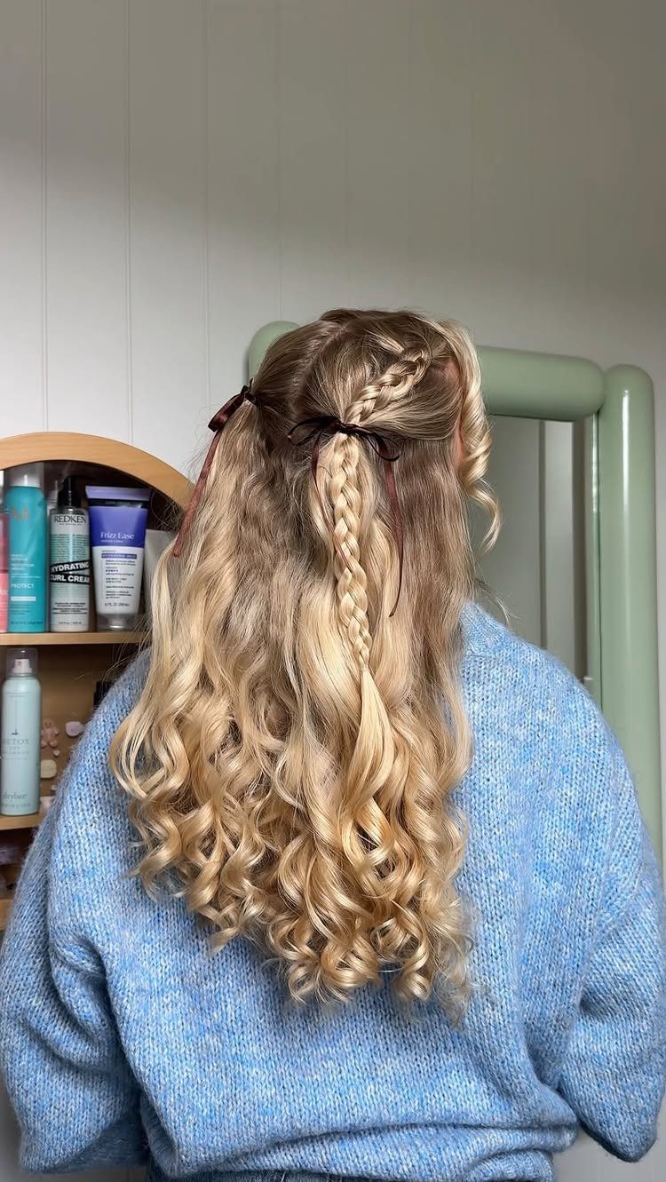 Fall Hair Dos with 15 Ideas from Burnt Copper to Claw Clips 15 Long curly blonde hair in a half-up half-down style with a braid and ribbons.