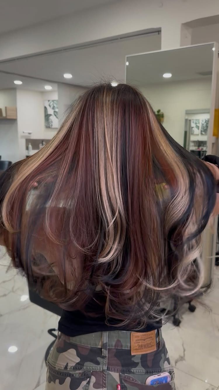 22 Hair Color Red and Blonde Ideas for Every Length 2 Long wavy burgundy brown hair with bright blonde highlights seen from behind.