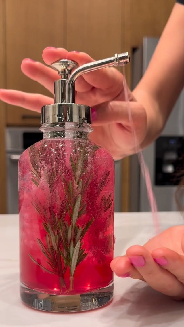 3 Hair Growth Tips at Home: Lemon, Rosemary, Serum 2 Glass pump bottle with red liquid and rosemary sprig being dispensed into hand