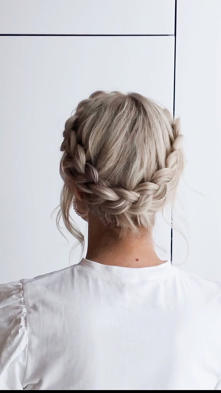 15 Ways to Pick a Hairstyle for Sweater Weather 6 Blonde hair styled in a Dutch braid crown seen from the back.