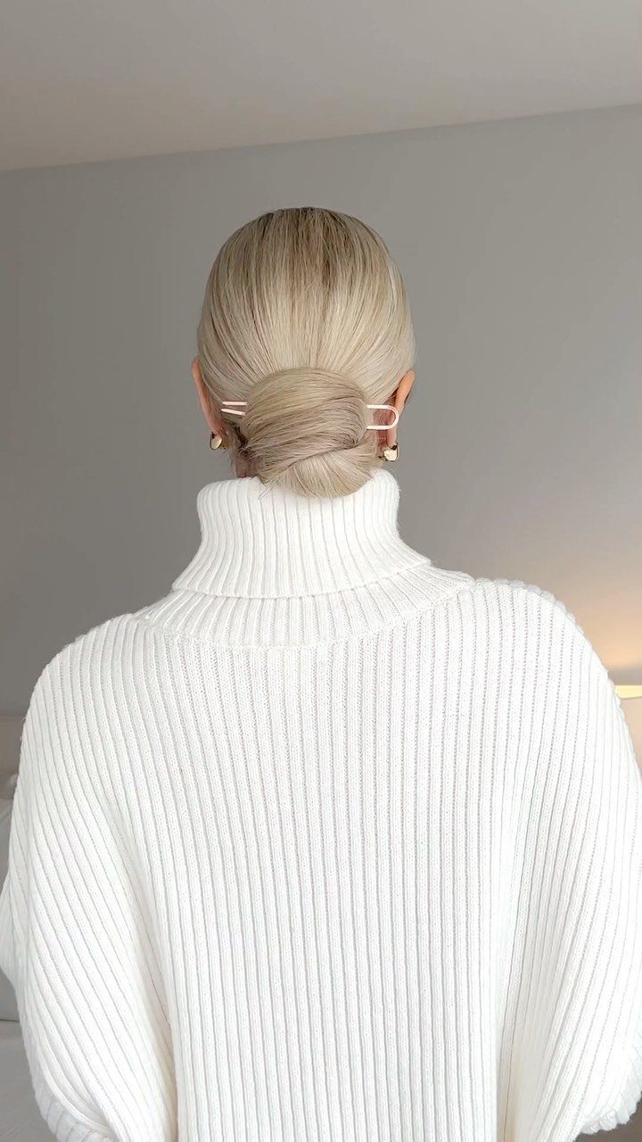 15 Ways to Pick a Hairstyle for Sweater Weather 11 Blonde hair in a sleek low bun with a gold pin and white sweater