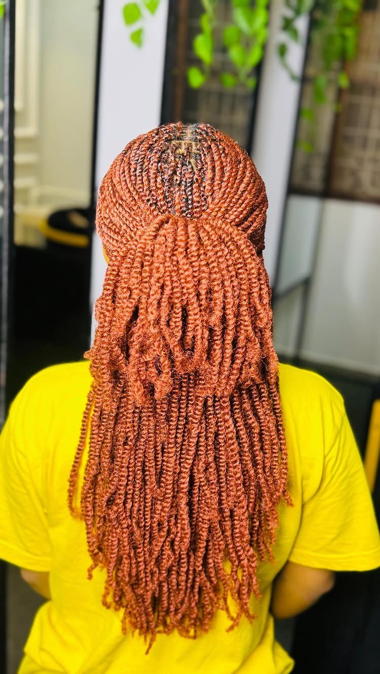 22 Hairstyles for Real Hair, from Bantu Knots to Bobs 3 Reddish-brown hair styled in long twists gathered into a ponytail, yellow t-shirt.