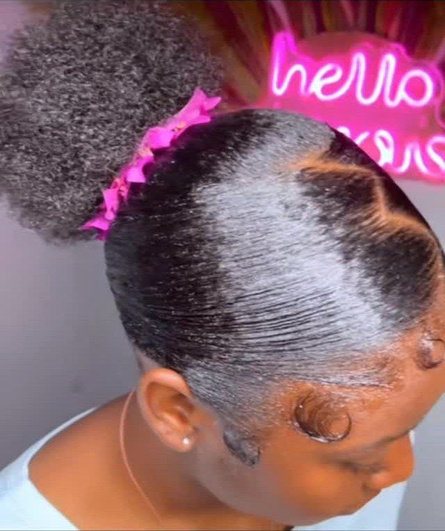 6 Hairstyles to Hide Bangs: Easy Ideas for Every Length 5 Woman with slicked-back hair and a high afro puff with pink hair tie