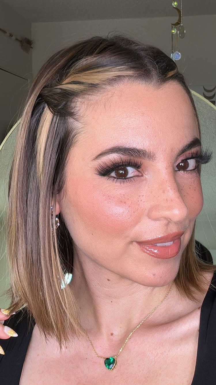6 Hairstyles to Hide Bangs: Easy Ideas for Every Length 2 Woman with highlighted hair using bobby pins to pin back her bangs.