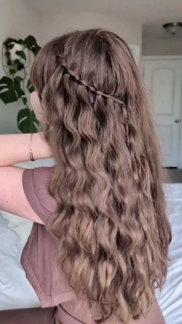 Half Braid Half Curly Hairstyles: 5 Ideas to Try 2 Long wavy brown hair with a waterfall braid and loose curls.