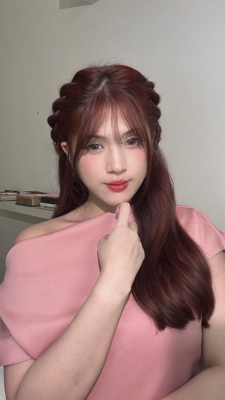 Half Braid Half Curly Hairstyles: 5 Ideas to Try 5 Woman with reddish-brown hair featuring side braids and loose curly waves.