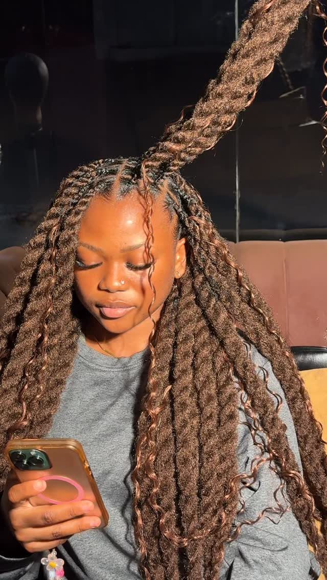 Healthy Hair Styles: 17 Protective Ideas for Natural Hair 5 Woman with long brown faux locs gathered into a high ponytail holding a phone
