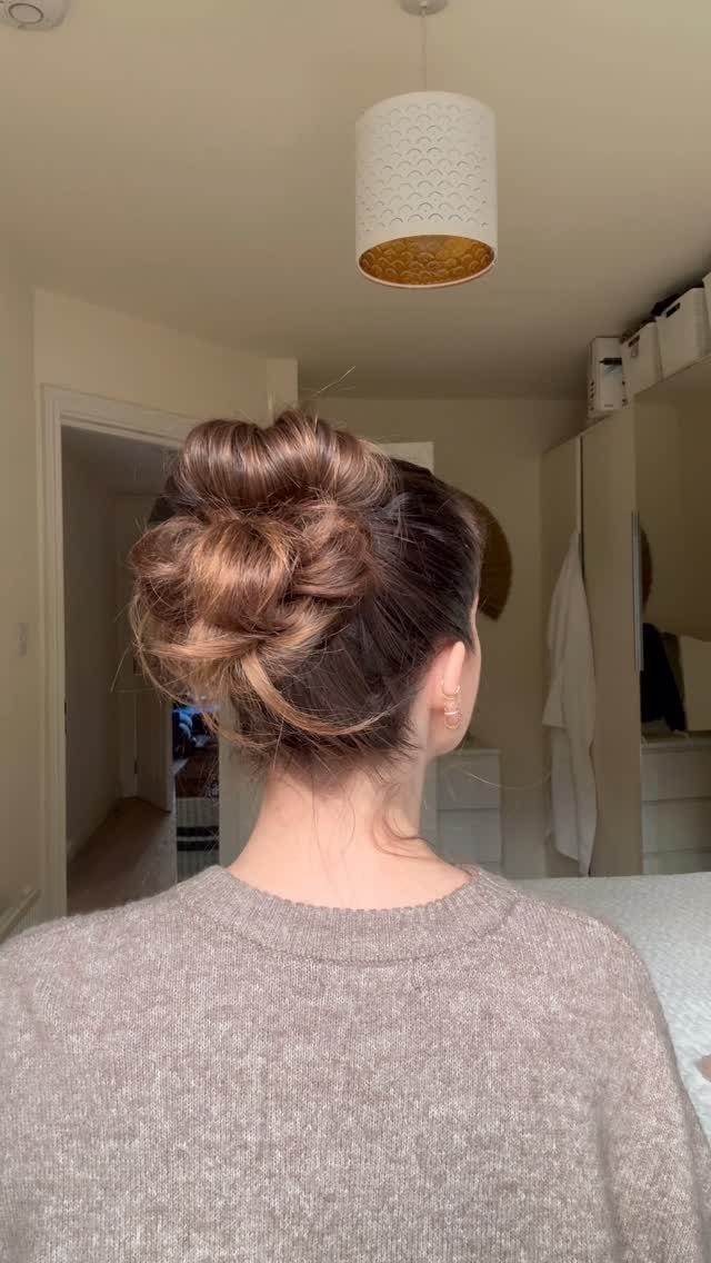 Healthy Hair Styles: 17 Protective Ideas for Natural Hair 17 Brown hair styled in a textured bun seen from behind on a person.