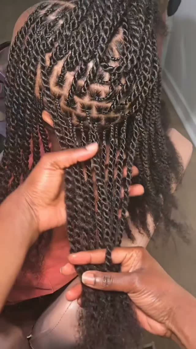 Healthy Hair Styles: 17 Protective Ideas for Natural Hair 12 Long black Marley twists being held by hands to show texture and parting.