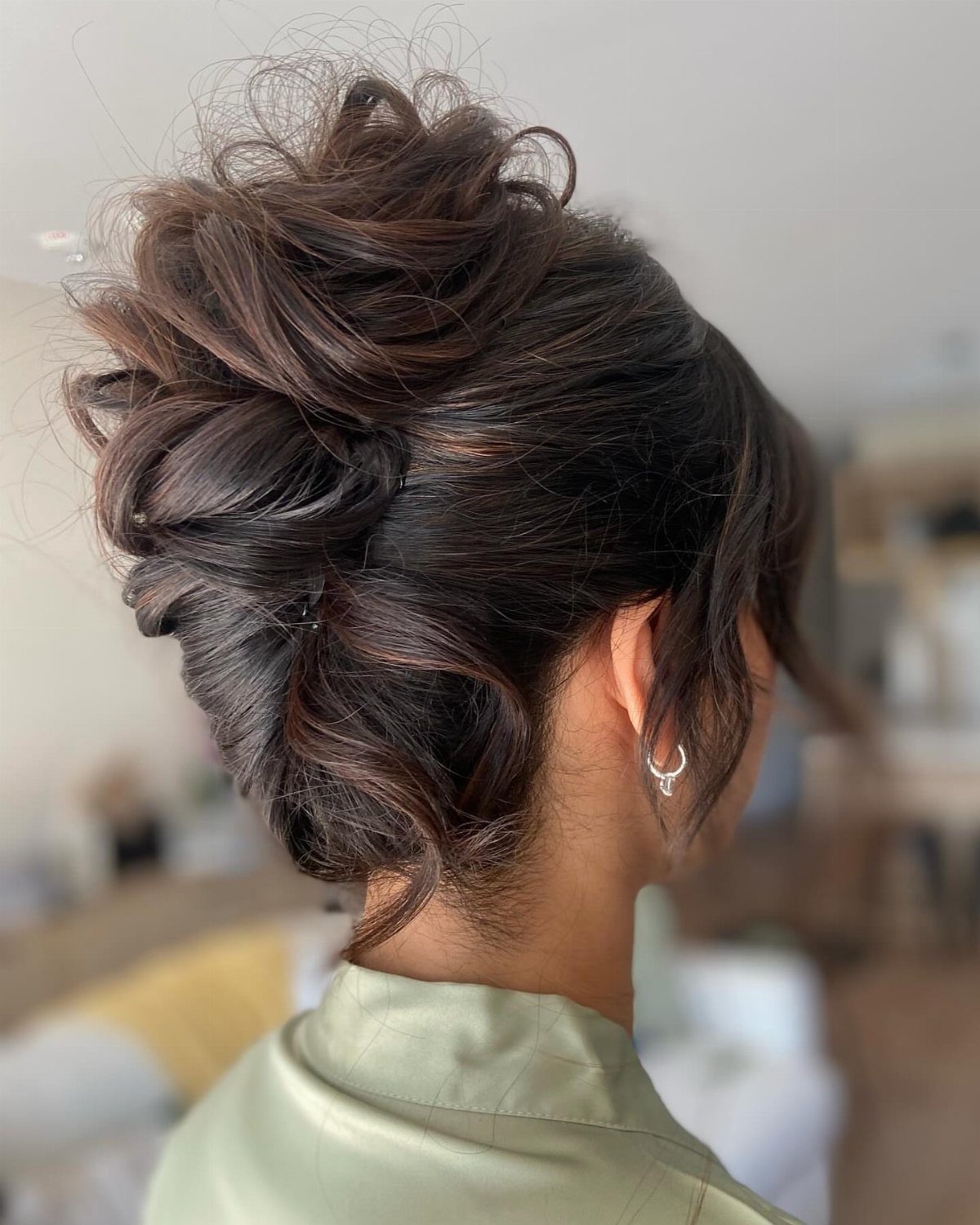 Healthy Hair Styles: 17 Protective Ideas for Natural Hair 6 Brown hair styled in a voluminous textured updo with loose curls and twists.