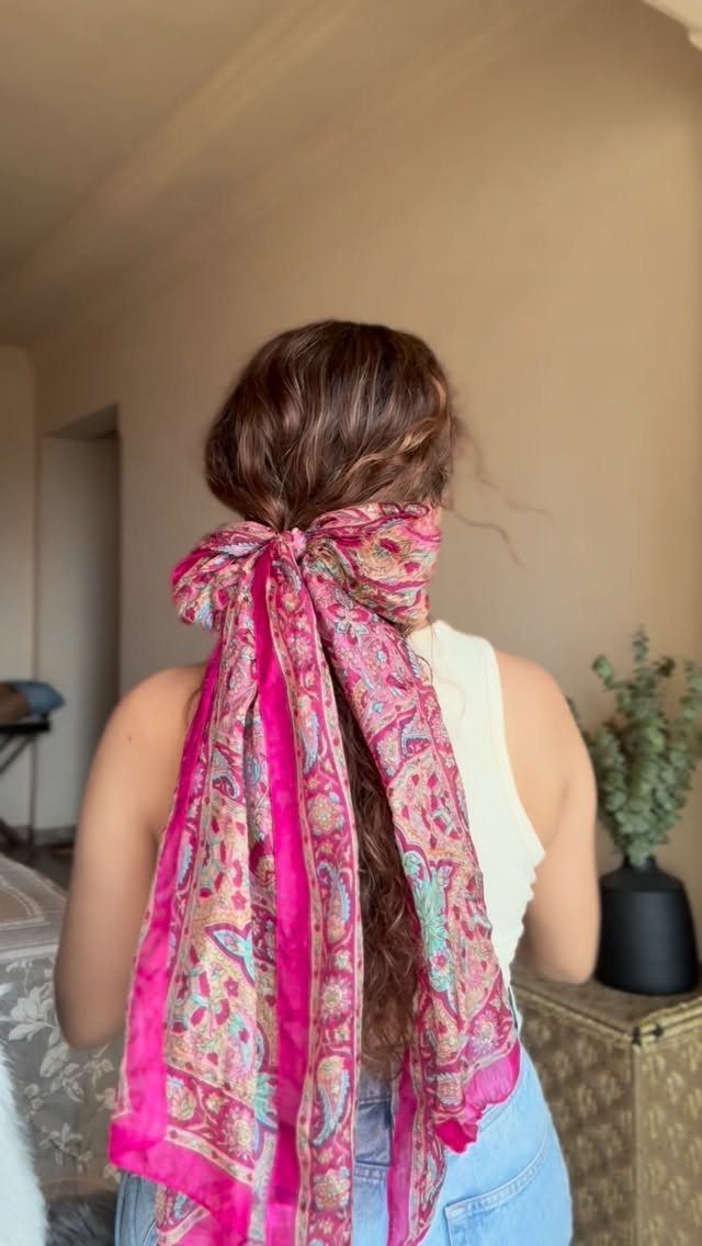 Healthy Hair Styles: 17 Protective Ideas for Natural Hair 15 Woman with long brown hair tied with a large pink patterned silk scarf.